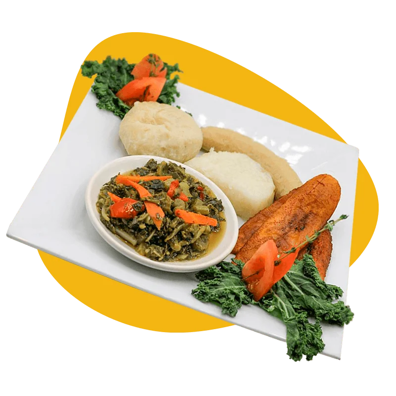 Dish with plantain slices and side of green vegetables and carrot