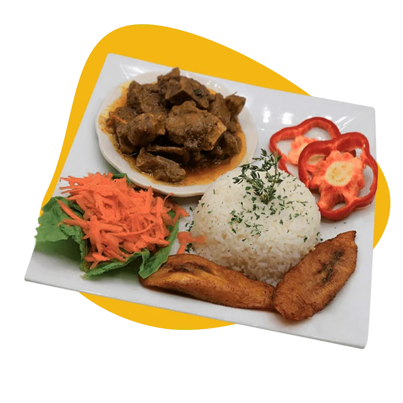 Rice dish with plantain slices, salad, slices of red pepper and a small plate of meat in sauce